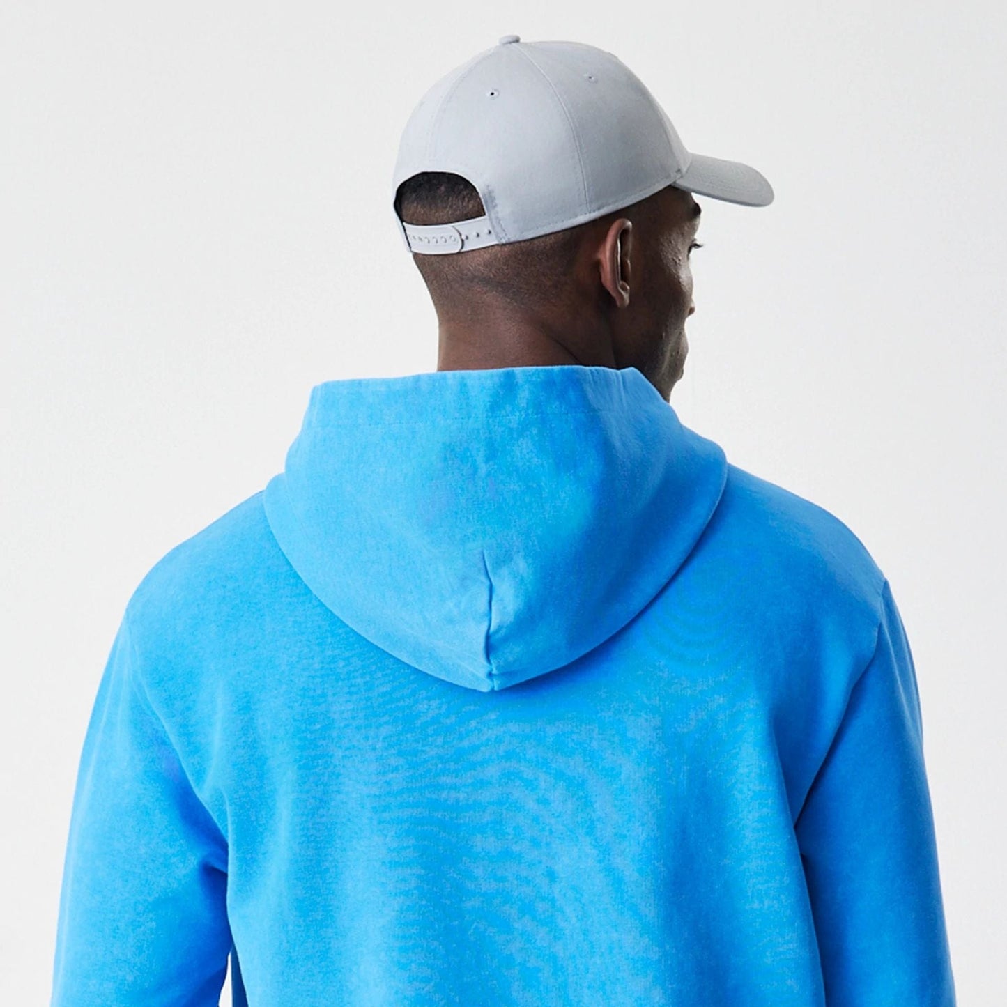 The Male model is wearing Red Bull Racing Blue Oversized Full Zip Hoodie 7