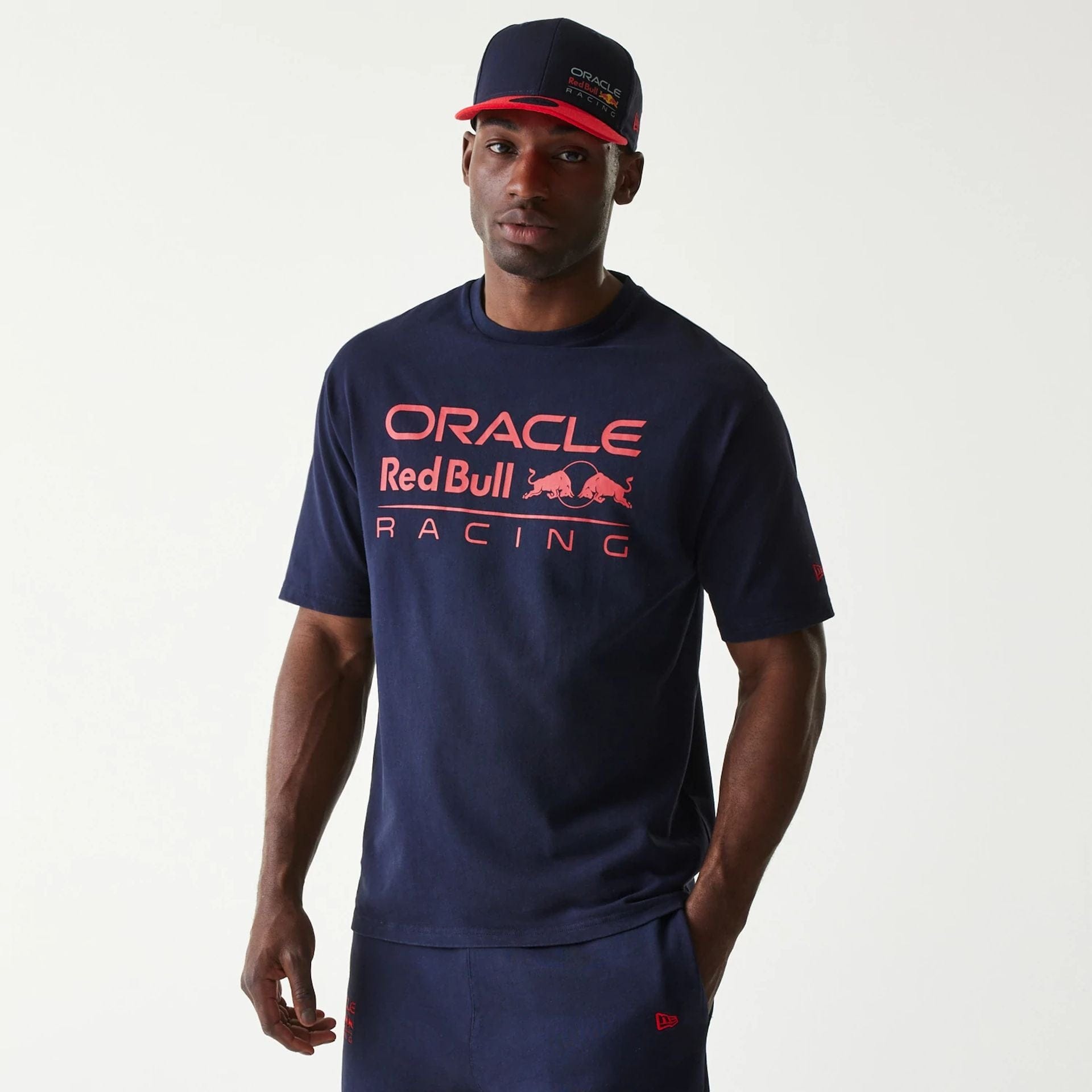 The Male model is wearing Red Bull Racing Dark Blue Oversized T-Shirt 1