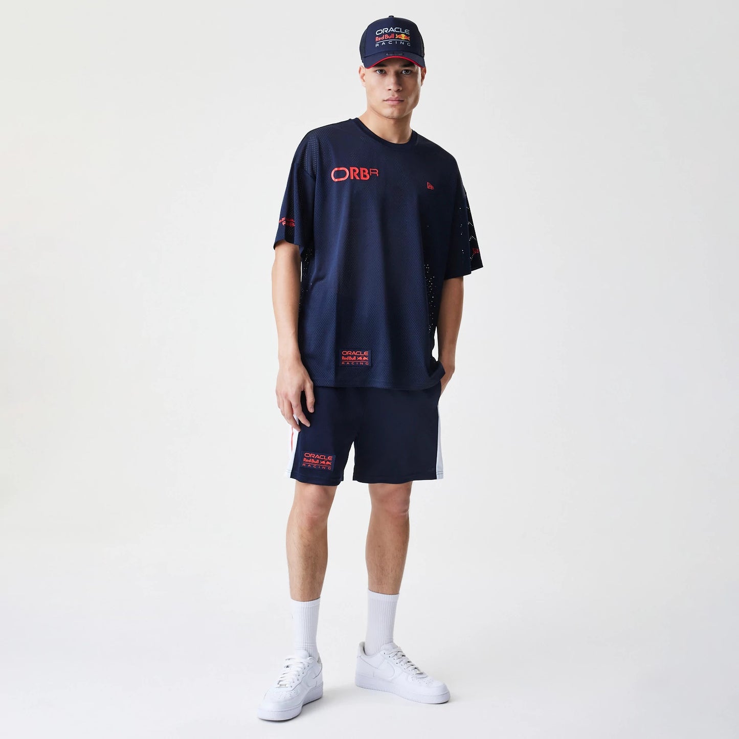 The Male model is wearing Red Bull Racing Graphic Mesh Dark Blue Oversized T-Shirt 8