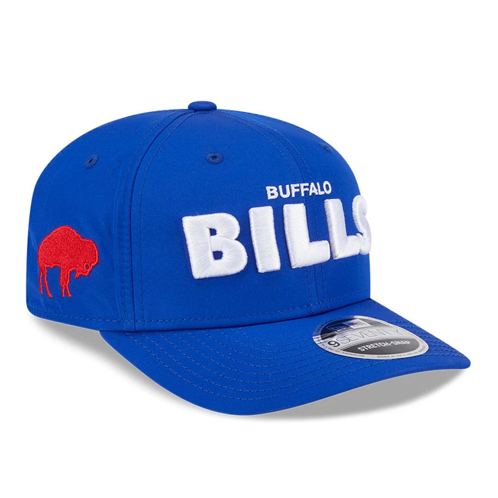 Buffalo Bills NFL Coach Blue New Era 9SEVENTY Stretch Snap Adjustable Cap, three-quarter view showing raised white embroidered BILLS text on the front panel and an embroidered red buffalo on the left side.