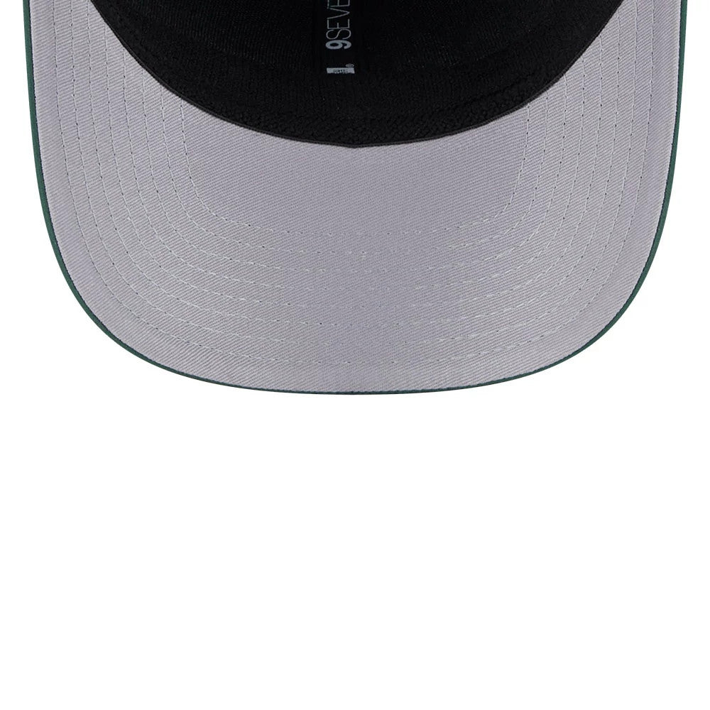 Green Bay Packers NFL Coach Dark Green New Era 9SEVENTY Stretch Snap Adjustable Cap, inside view showing a grey undervisor, black sweatband, and taping with New Era branding along the inner seams.