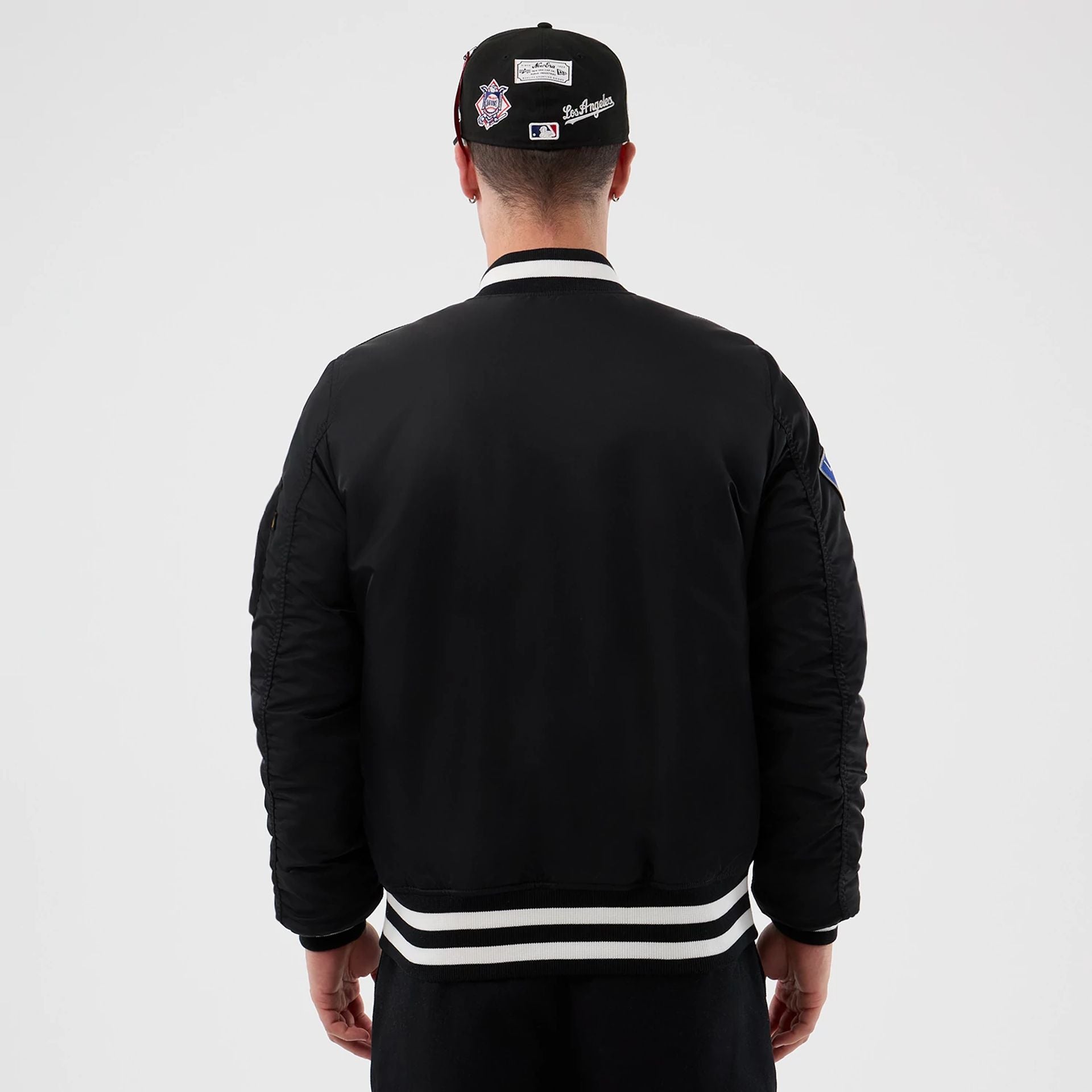 The Male model is wearing LA Dodgers MLB X Alpha Black Bomber Jacket 2