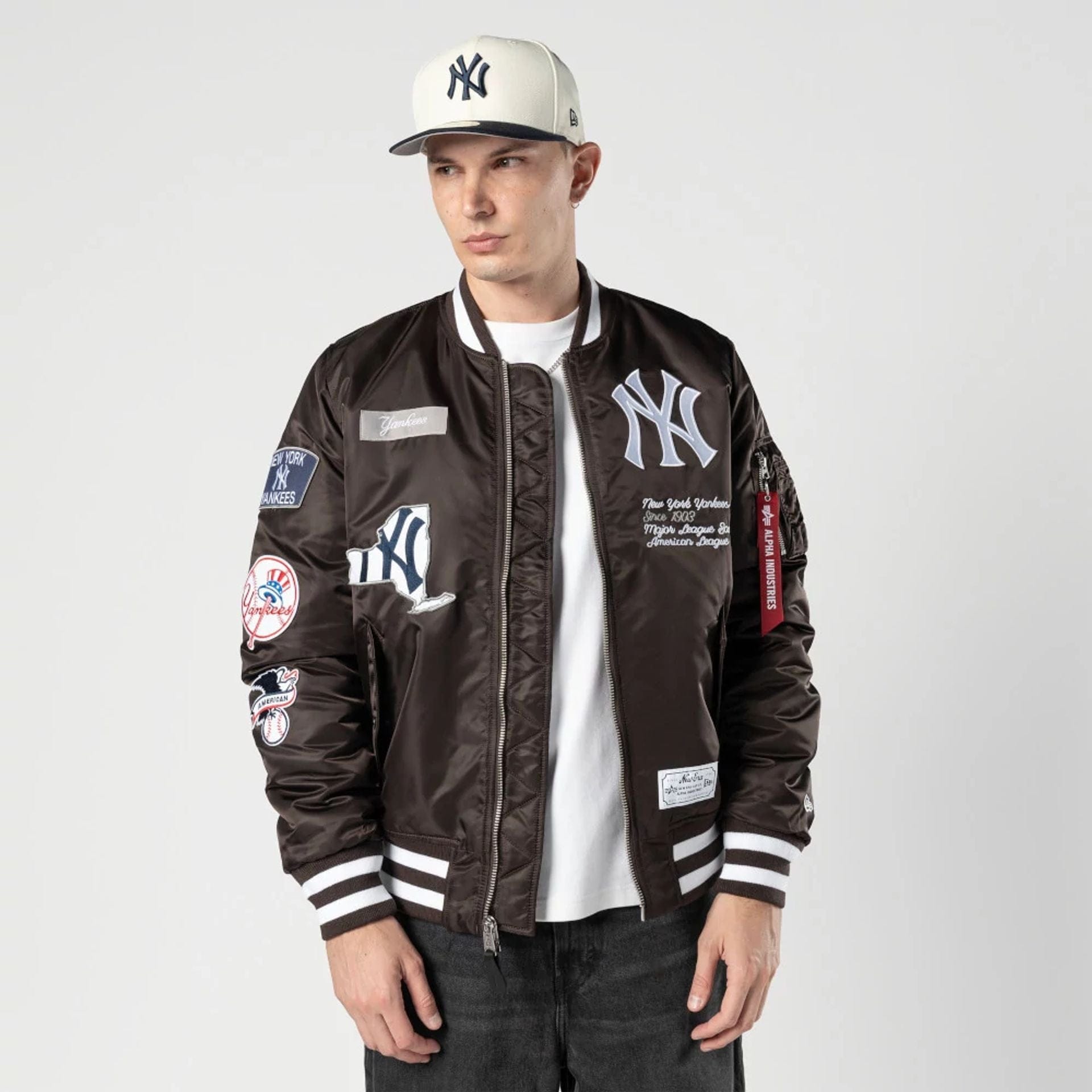 The Male model is wearing New York Yankees MLB X Alpha Dark Brown Bomber Jacket 1
