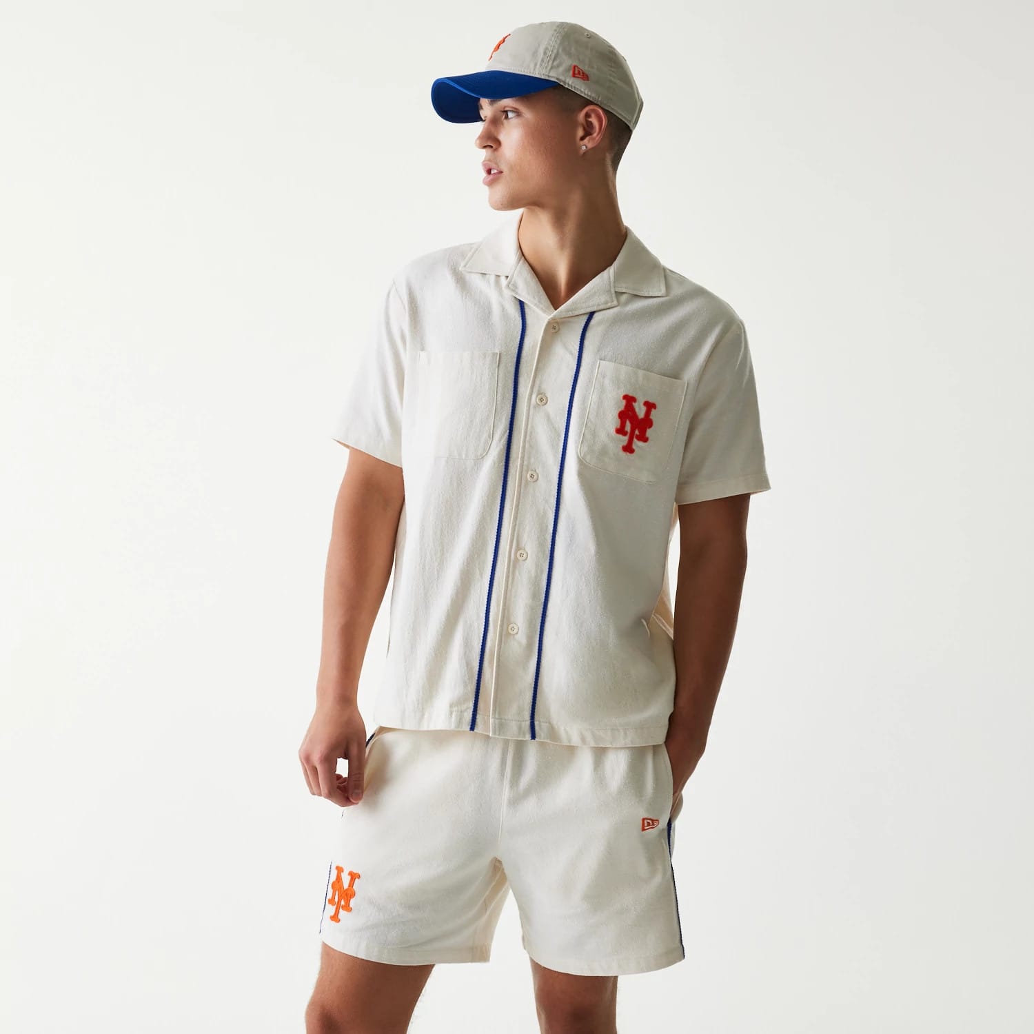 The Male model is wearing New York Mets MLB Piping Open Cream Short Sleeve Shirt 1