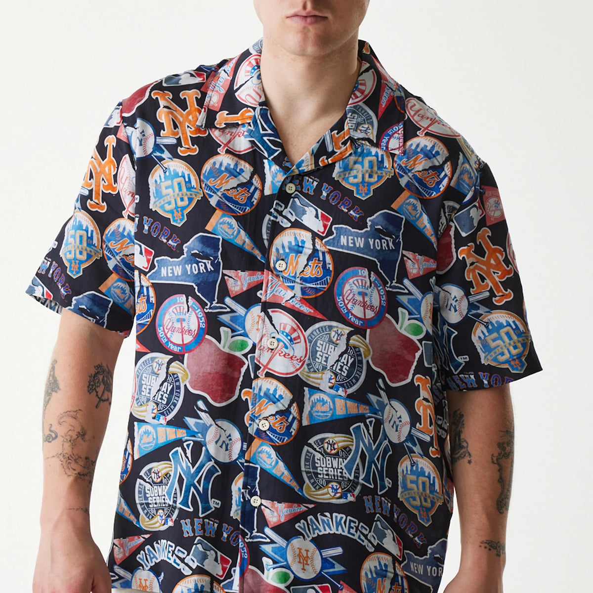 The Male model is wearing MLB Subway Series All Over Print Navy Short Sleeve Shirt 3