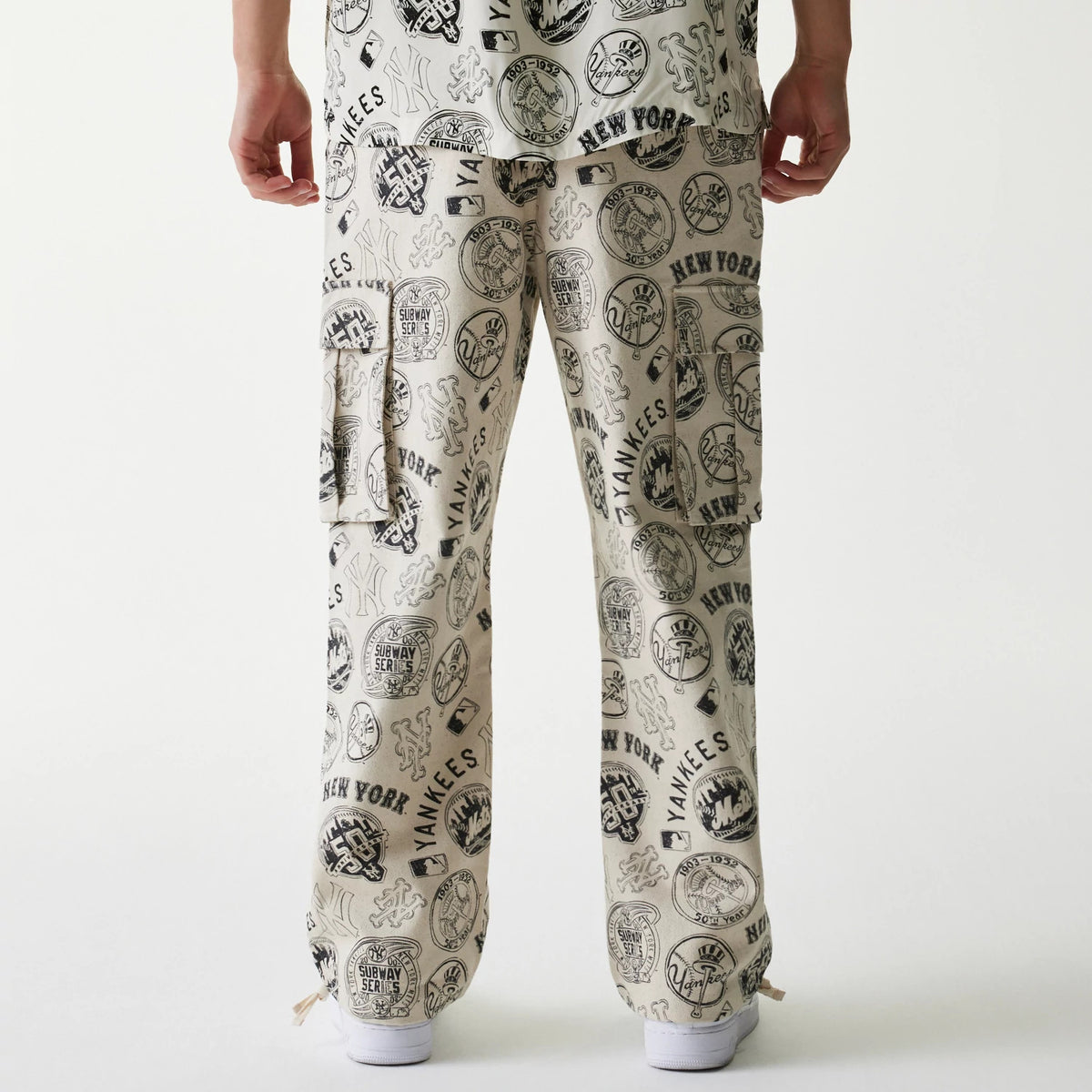 The Male model is wearing MLB Subway Series All Over Print Cargo Trousers 2