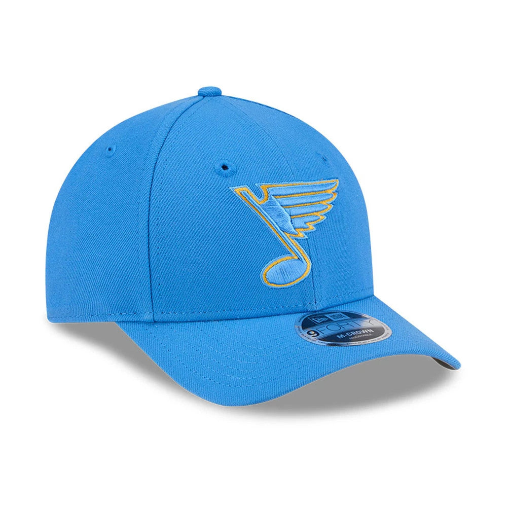 St. Louis Blues NHL Team Blue New Era 9FORTY M-Crown Adjustable Cap, front view showing the raised yellow and blue embroidered logo on the structured blue crown, with a curved visor and 9FORTY size sticker.
