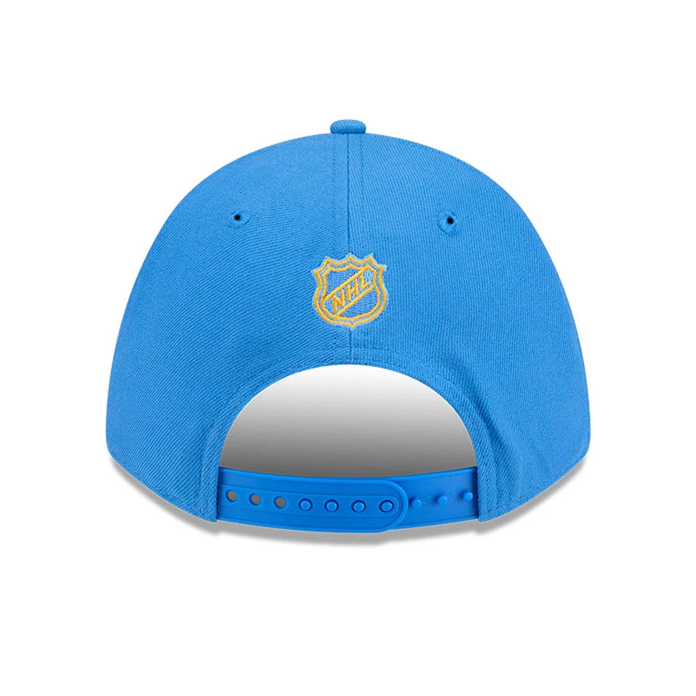 St. Louis Blues NHL Team Blue New Era 9FORTY M-Crown Adjustable Cap, rear view showing the yellow embroidered NHL shield logo at the centre, with an adjustable blue snap closure beneath the structured blue crown.