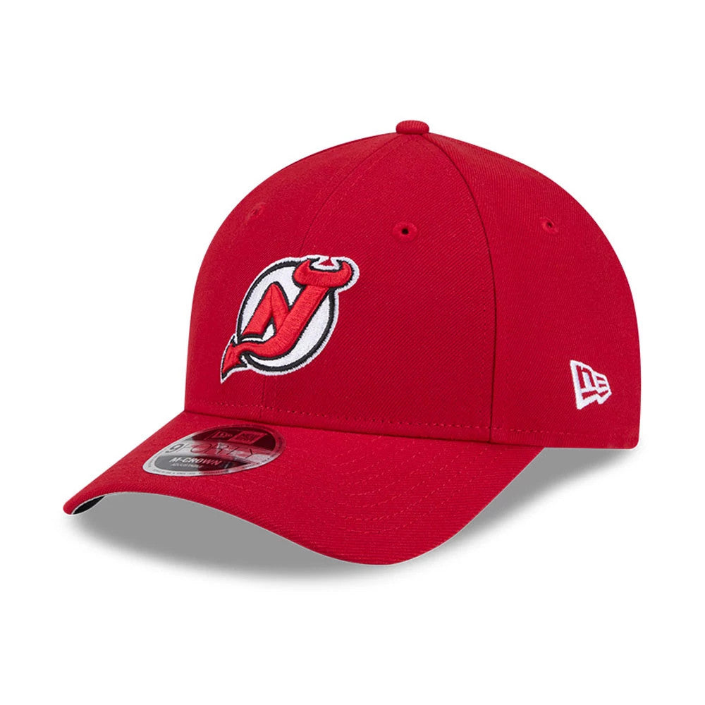 New Jersey Devils NHL Team Red New Era 9FORTY M-Crown Adjustable Cap, three-quarter view showing the raised embroidered Devils logo on the front panel, curved red visor with 9FORTY size sticker, and white New Era flag logo on the left side.