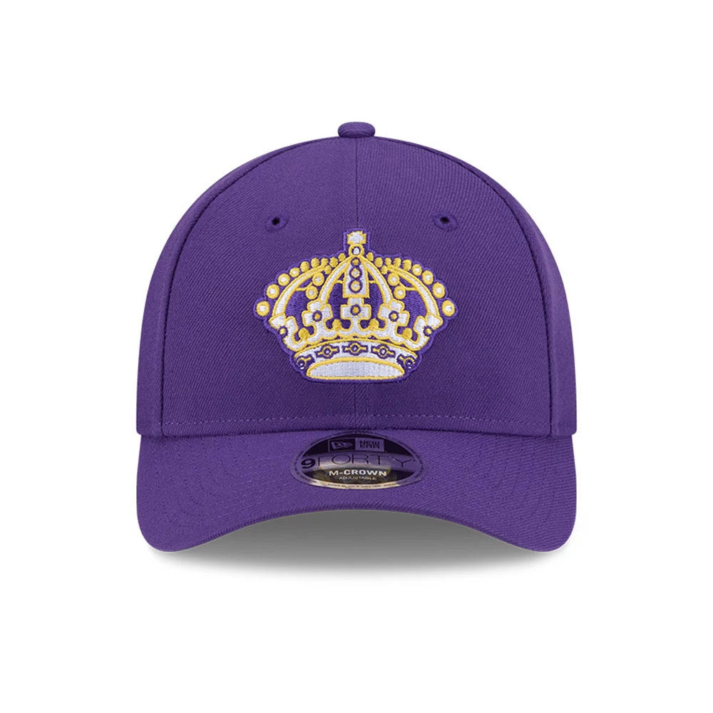 LA Kings NHL Team Purple New Era 9FORTY M-Crown Adjustable Cap, front view showing a gold and white embroidered crown logo centred on the structured purple crown above the 9FORTY size sticker on the curved visor.