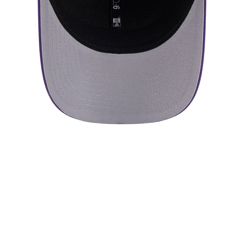 LA Kings NHL Team Purple New Era 9FORTY M-Crown Adjustable Cap, inside view showing the black sweatband with brand label, grey undervisor, and purple stitching on the edge of the curved visor.