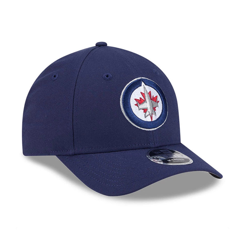 Winnipeg Jets NHL Team Navy New Era 9FORTY M-Crown Adjustable Cap, three-quarter view showing the team's logo with raised embroidery on the front panel, a pre-curved visor, and a 9FORTY size sticker.