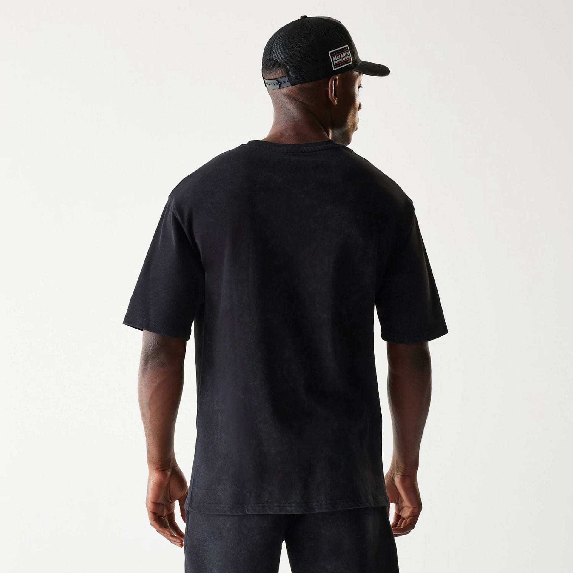The Male model is wearing McLaren Racing Wordmark Black Oversized T-Shirt 2