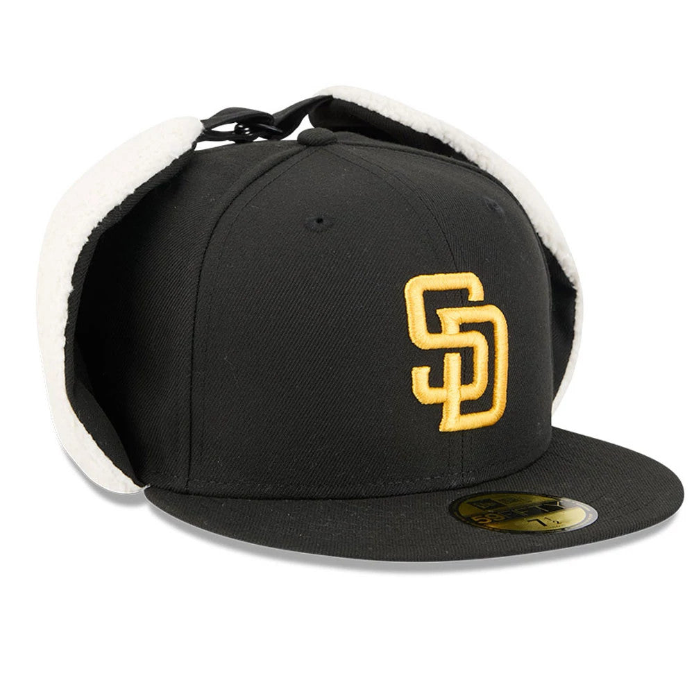 San Diego Padres MLB Classic Black Dogear New Era 59FIFTY Fitted Cap, three-quarter view showing the raised gold SD logo on the front panel, black flat visor with gold 59FIFTY size sticker, and white fleece-lined dogear flaps.