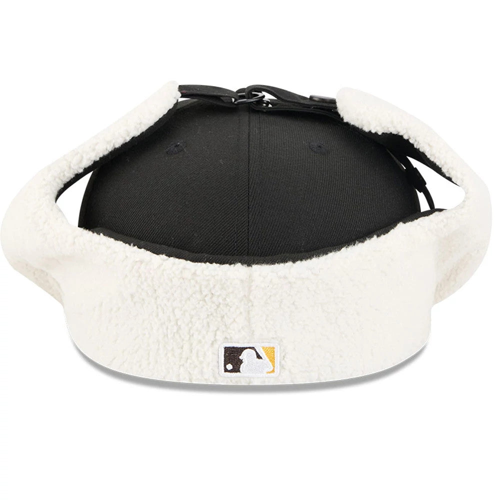 San Diego Padres MLB Classic Black Dogear New Era 59FIFTY Fitted Cap, rear view showing the MLB Batterman logo at the centre on the cream dogear flaps, with a structured black crown and black top button.