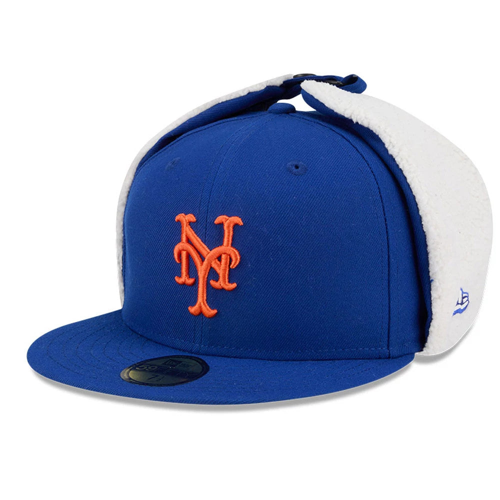 New York Mets MLB Classic Blue Dogear New Era 59FIFTY Fitted Cap, three-quarter view showing the orange Mets logo on the front panel, blue flat visor with the 59FIFTY size sticker, and white fleece-lined dogear flaps folded upwards.