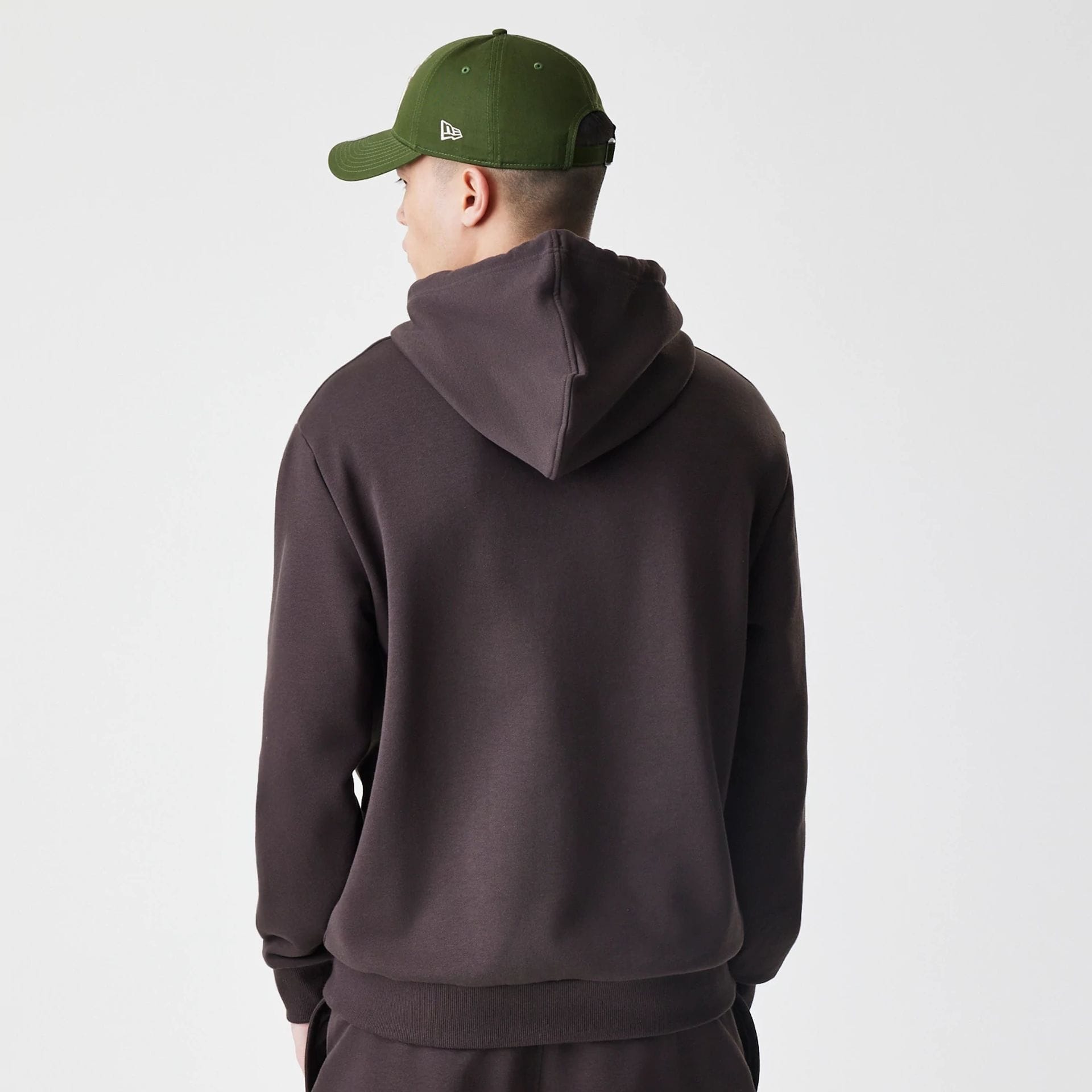 The Male model is wearing New York Yankees MLB Midi League Essential Dark Brown Oversized Pullover Hoodie 2