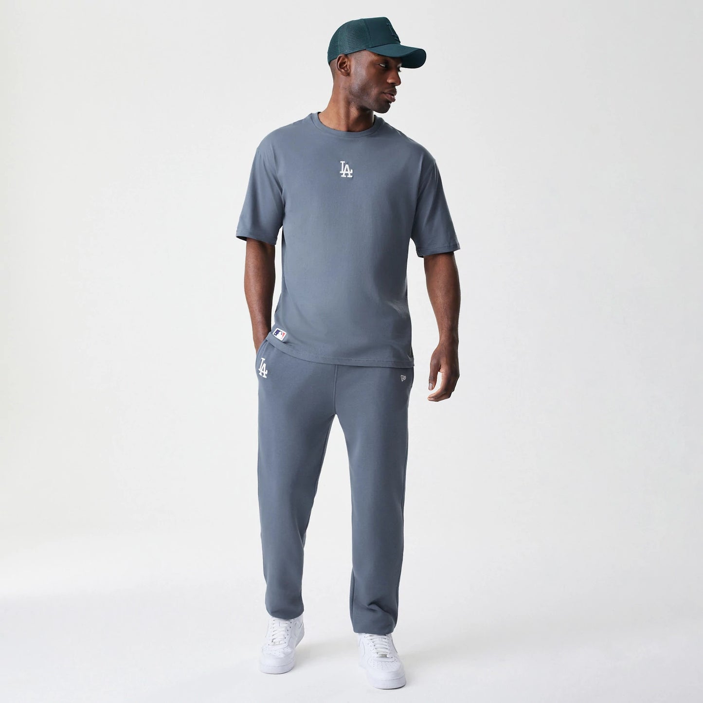 The Male model is wearing LA Dodgers MLB Midi League Essential Dark Grey Joggers 8