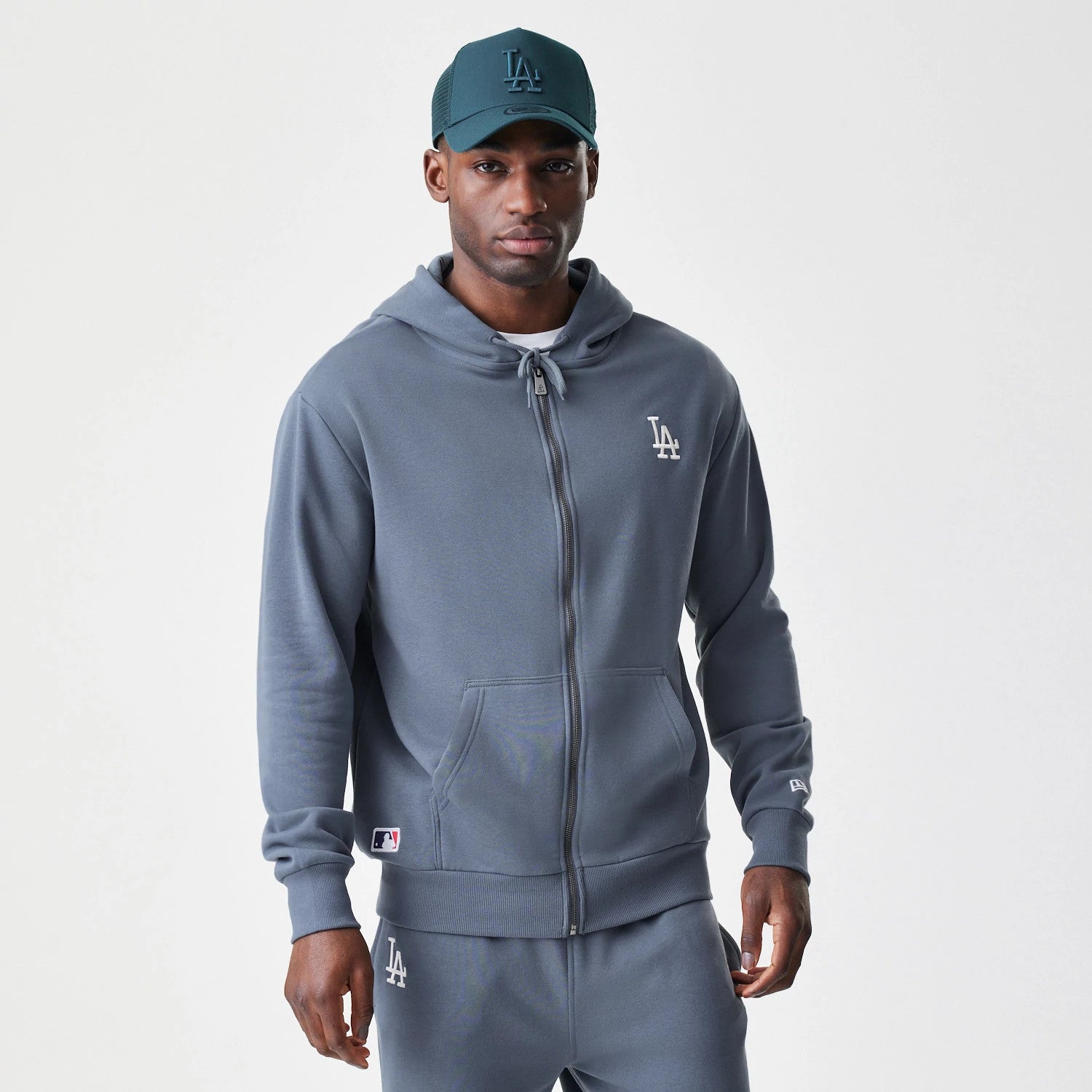 The Male model is wearing LA Dodgers MLB Midi League Essential Dark Grey Full Zip Hoodie 1