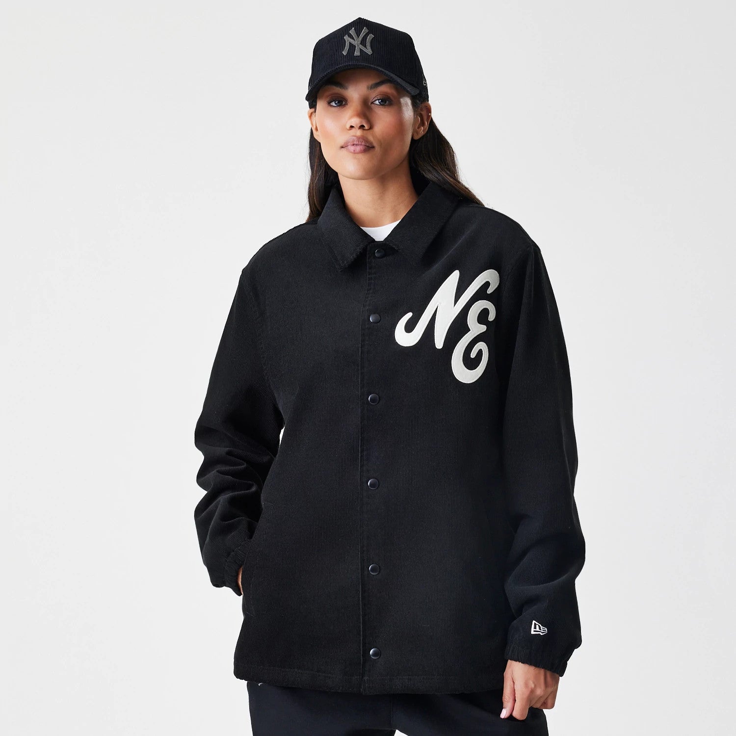 The Male model is wearing New Era Cord Black Coaches Jacket 4
