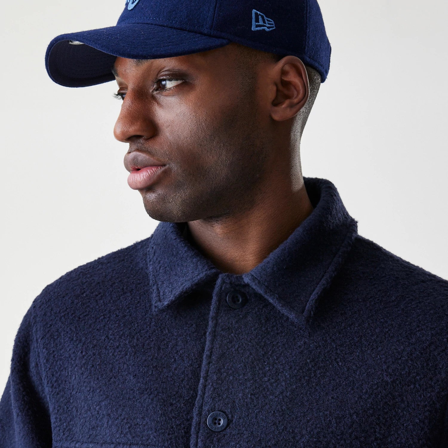 The Male model is wearing New Era Borg Navy Shacket 4