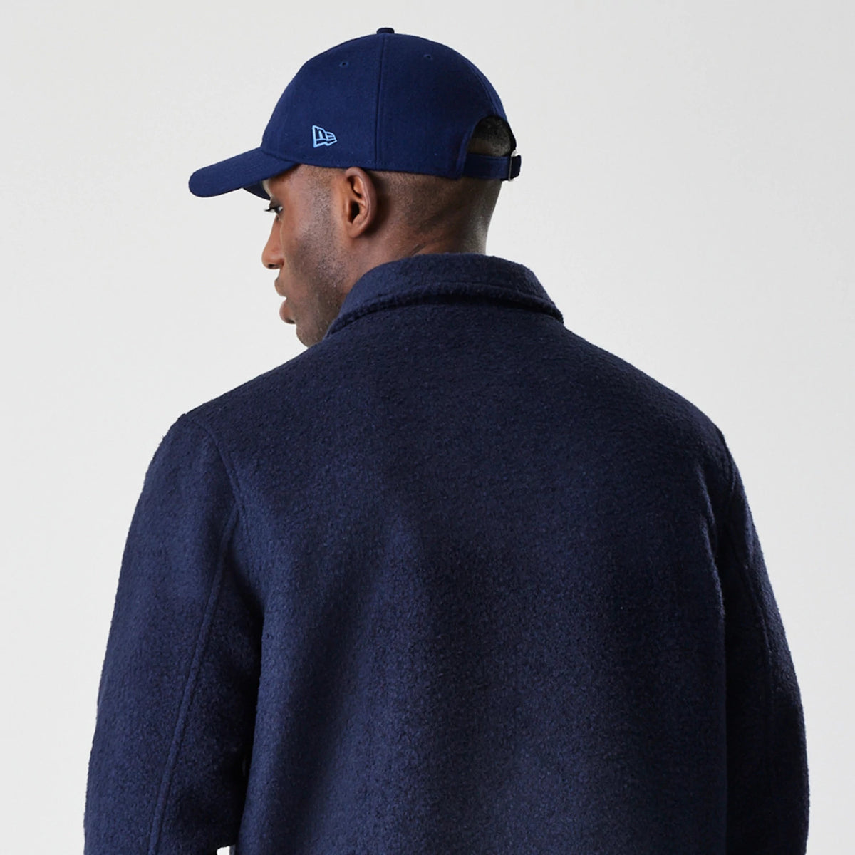 The Male model is wearing New Era Borg Navy Shacket 7