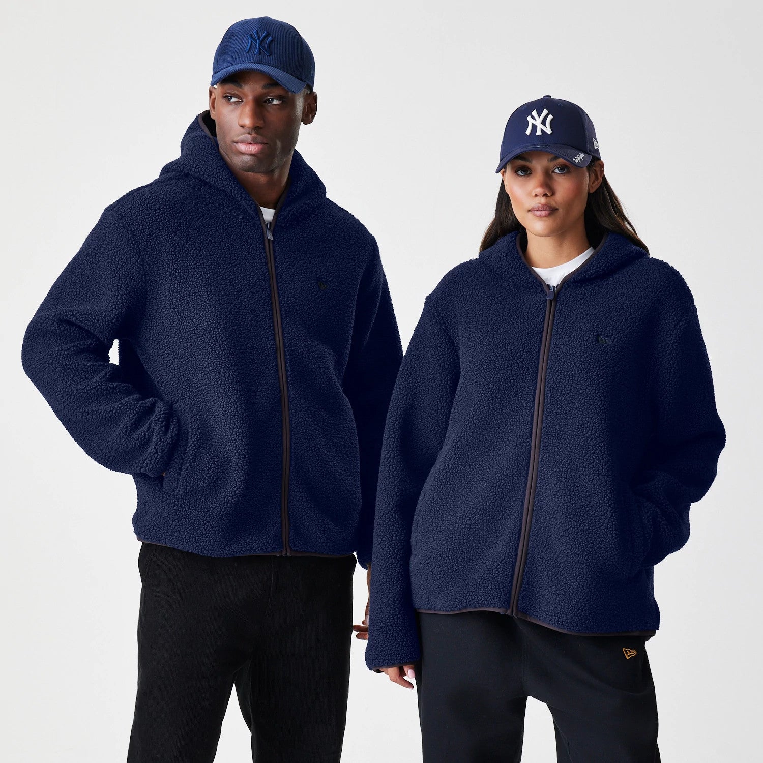 The Male model is wearing New Era Navy Hooded Sherpa Jacket 1