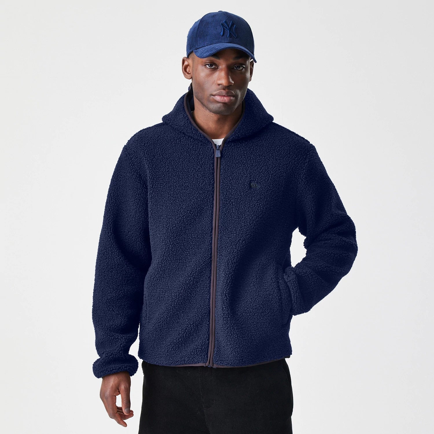 The Male model is wearing New Era Navy Hooded Sherpa Jacket 3