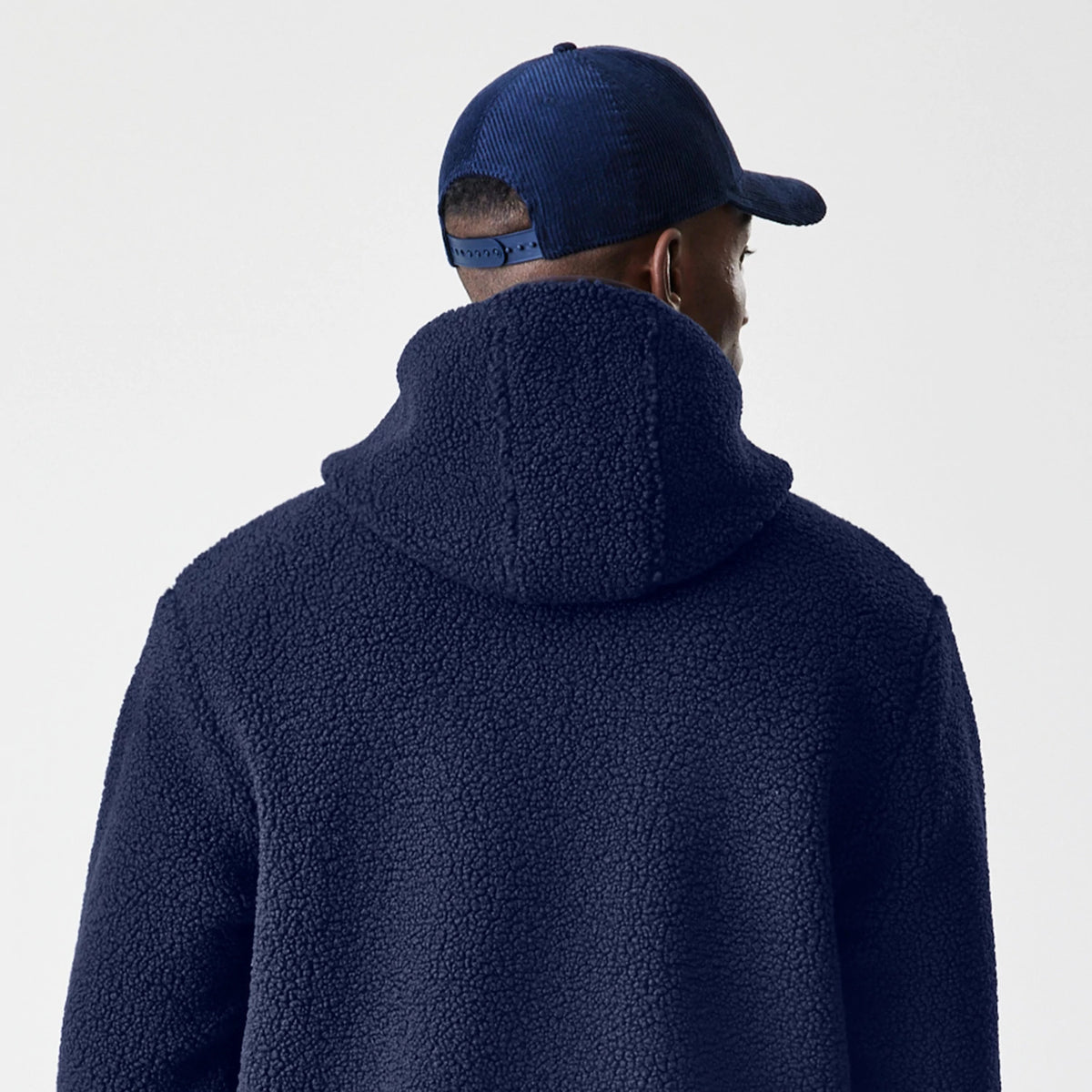 The Male model is wearing New Era Navy Hooded Sherpa Jacket 8