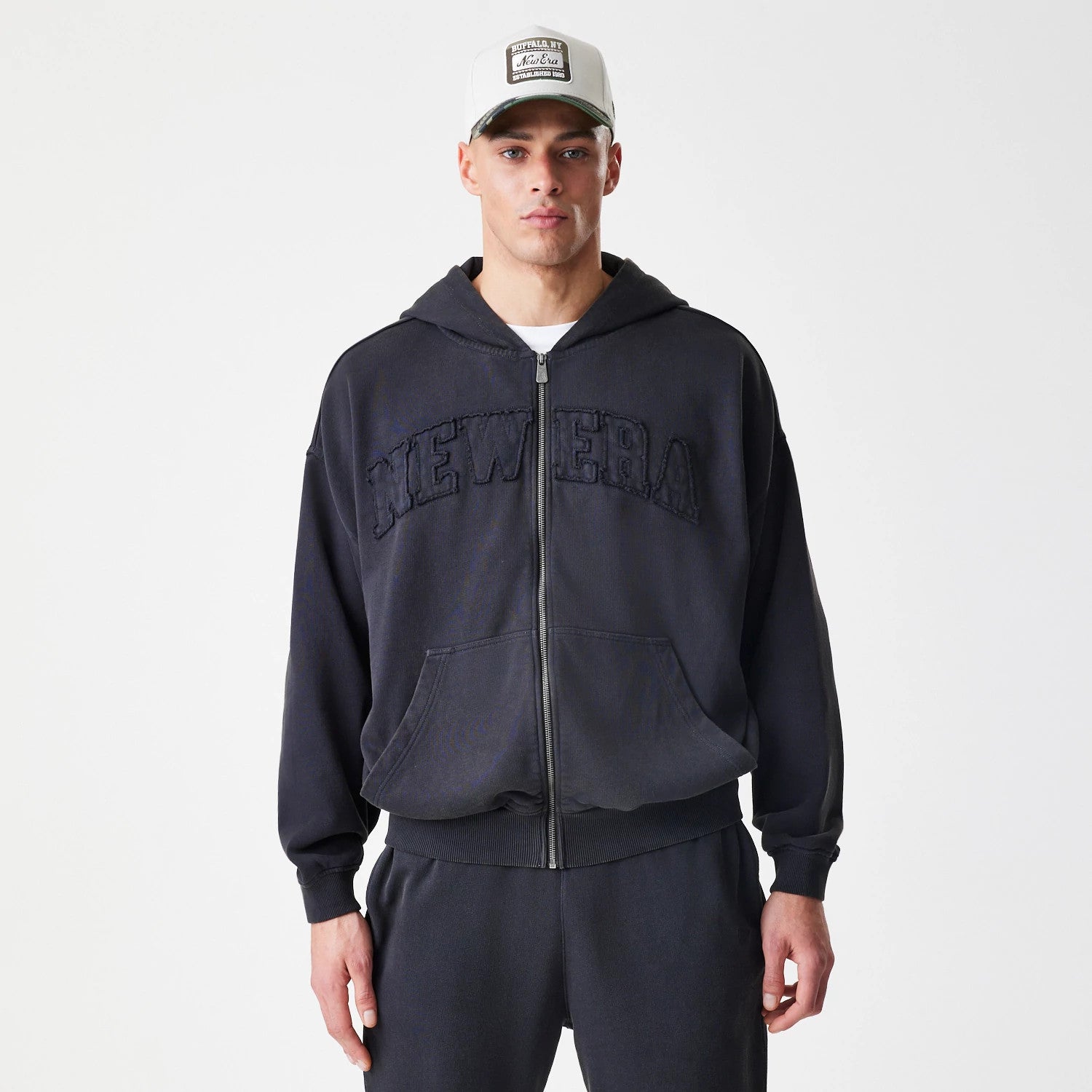 The Male model is wearing New Era Washed Black Oversized Full Zip Hoodie 3