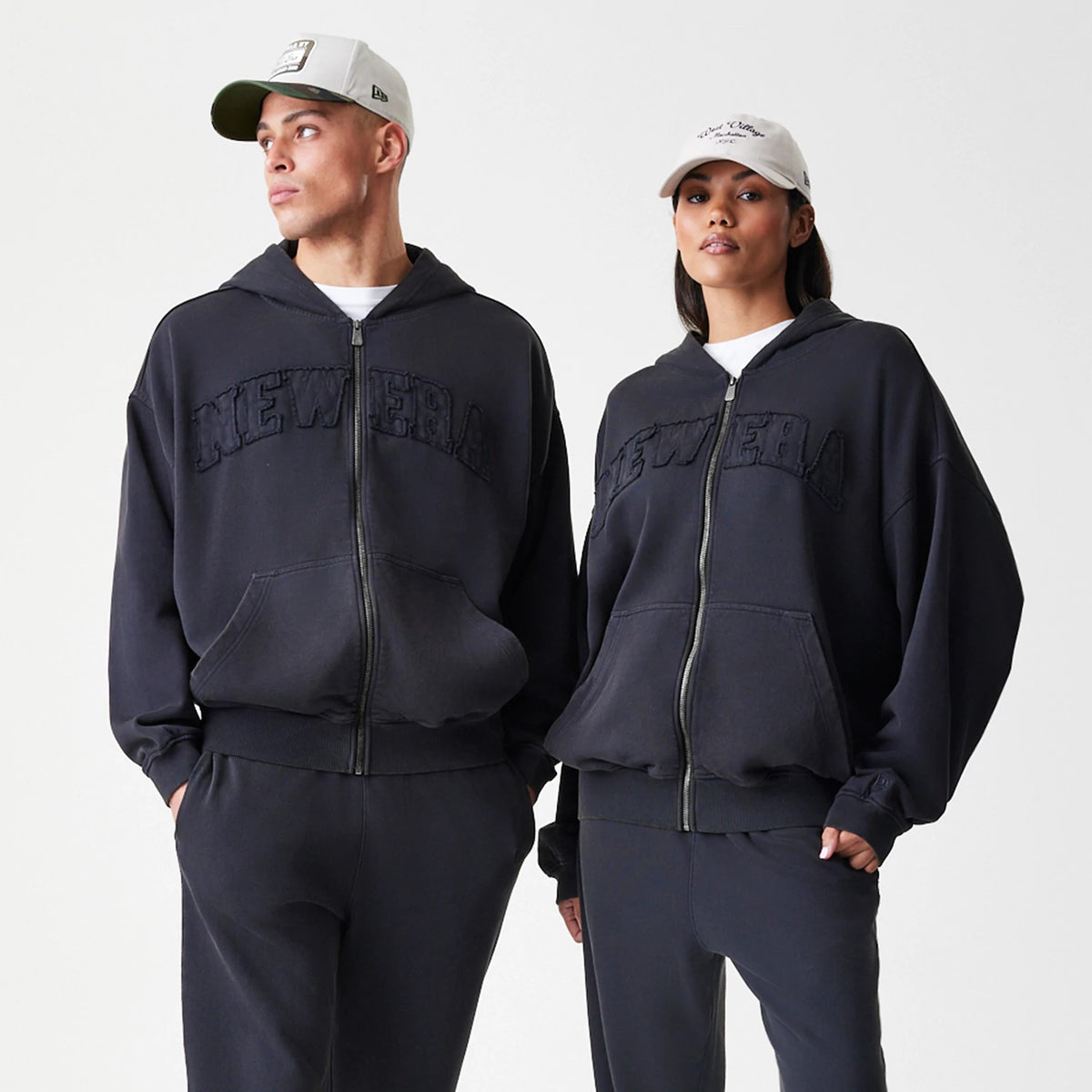 The Male model is wearing New Era Washed Black Oversized Full Zip Hoodie 8