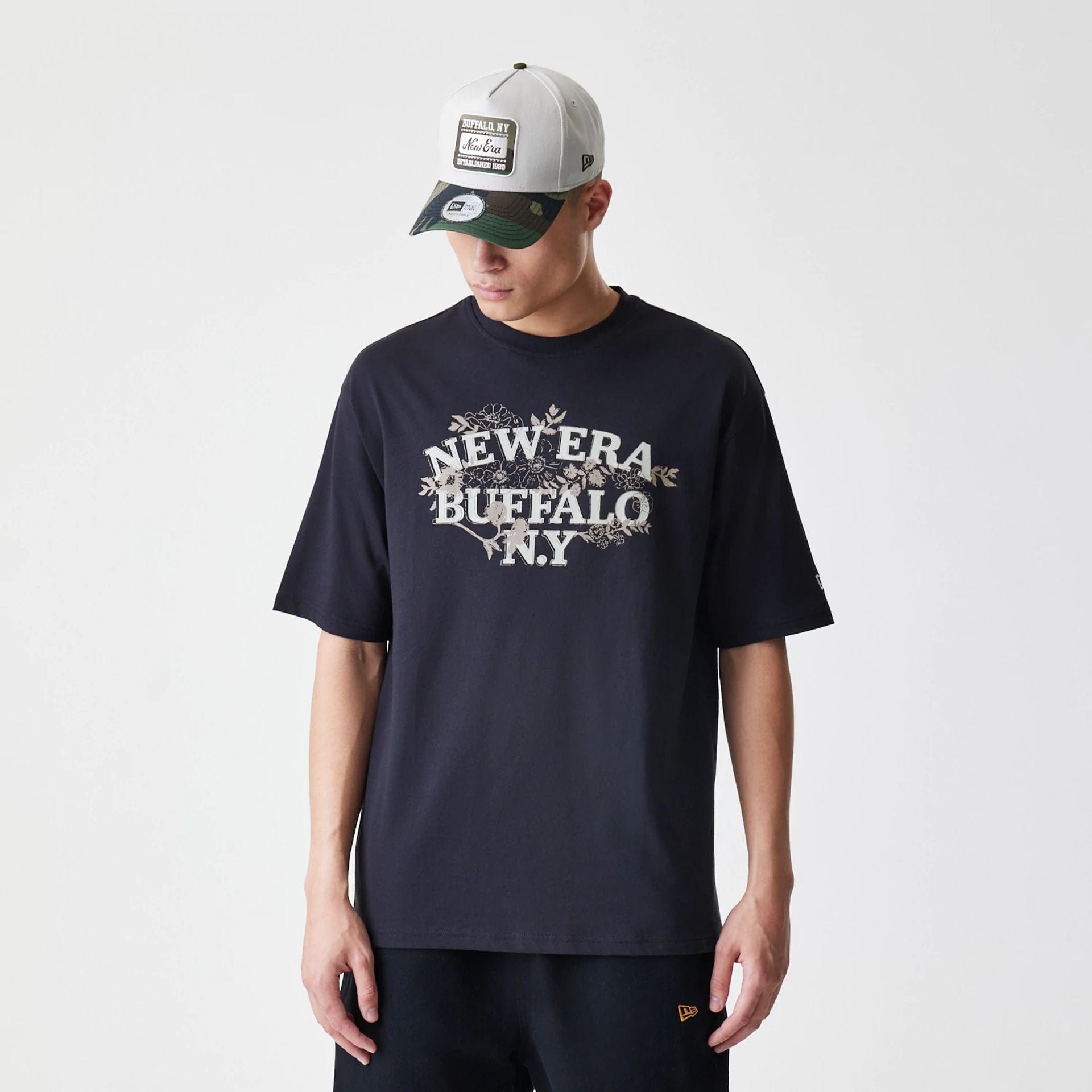 The Male model is wearing New Era Floral Black Oversized T-Shirt 1