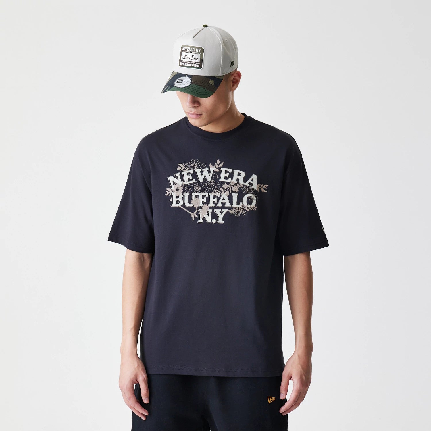 The Male model is wearing New Era Floral Black Oversized T-Shirt 1