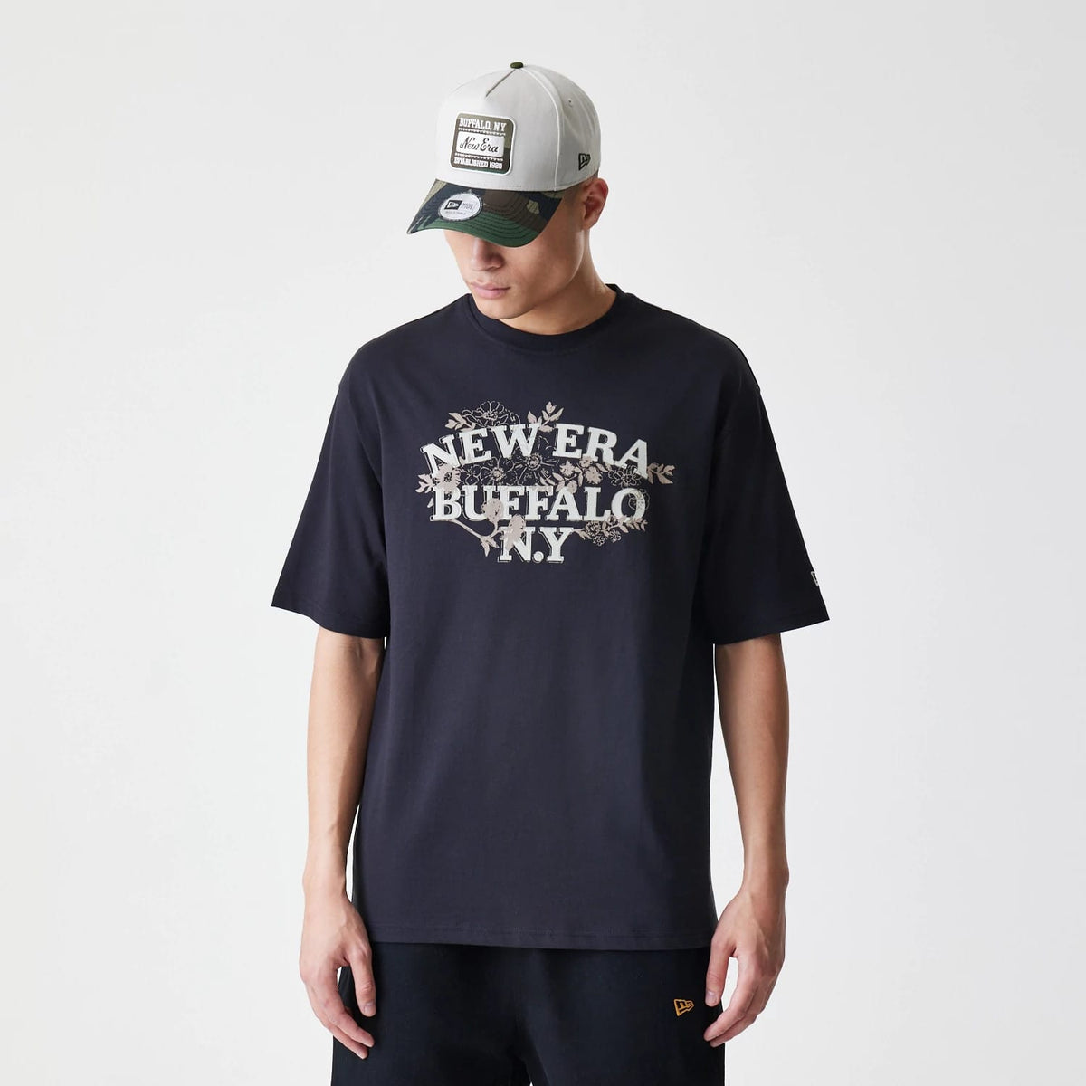 The Male model is wearing New Era Floral Black Oversized T-Shirt 1