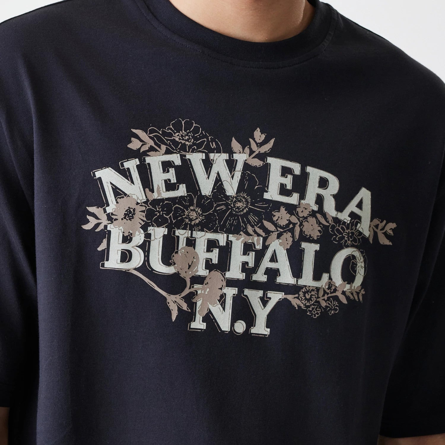 The Male model is wearing New Era Floral Black Oversized T-Shirt 4