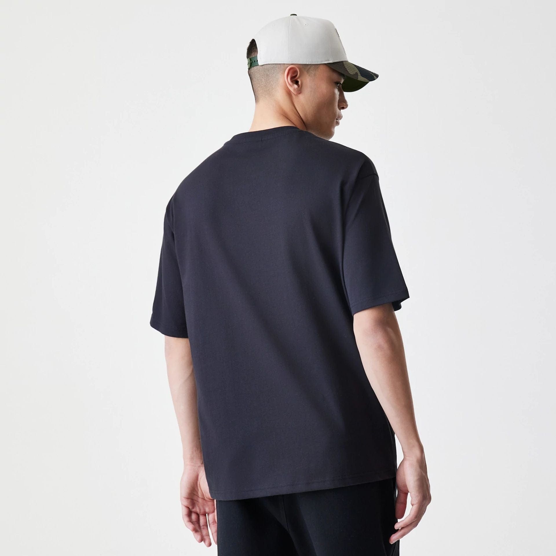 The Male model is wearing New Era Floral Black Oversized T-Shirt 2