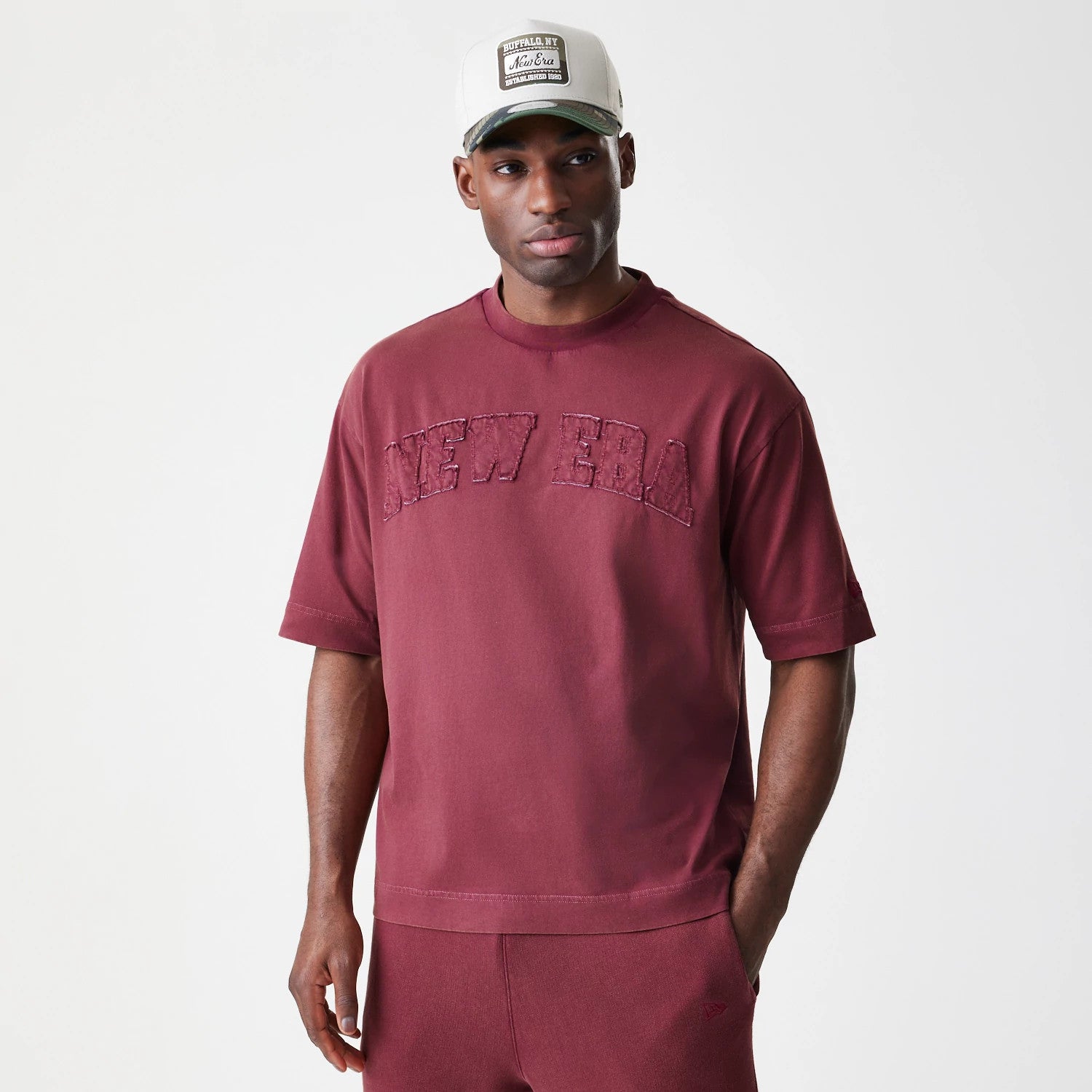 The Male model is wearing New Era Washed Dark Red Oversized T-Shirt 3