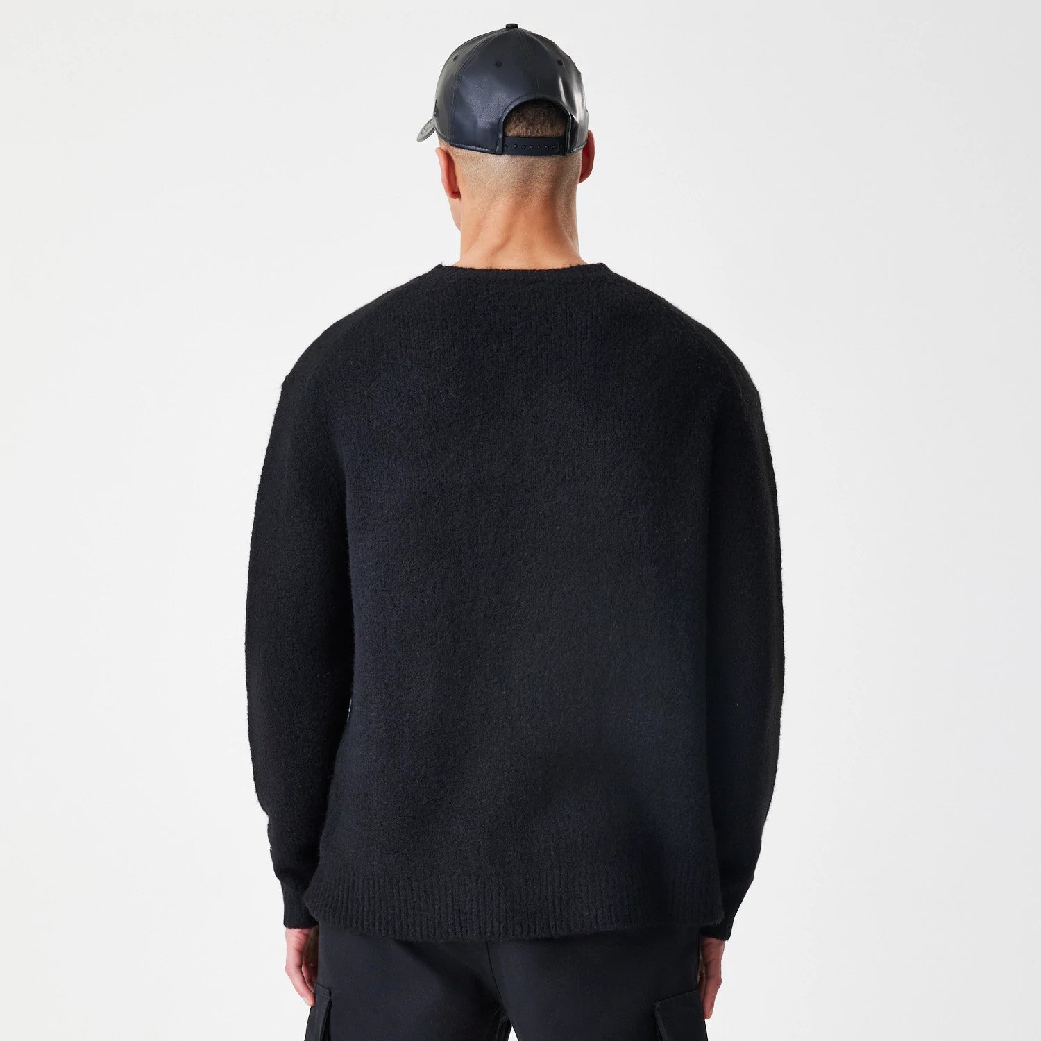 The Male model is wearing New Era Knit Black Knitted Sweater 2