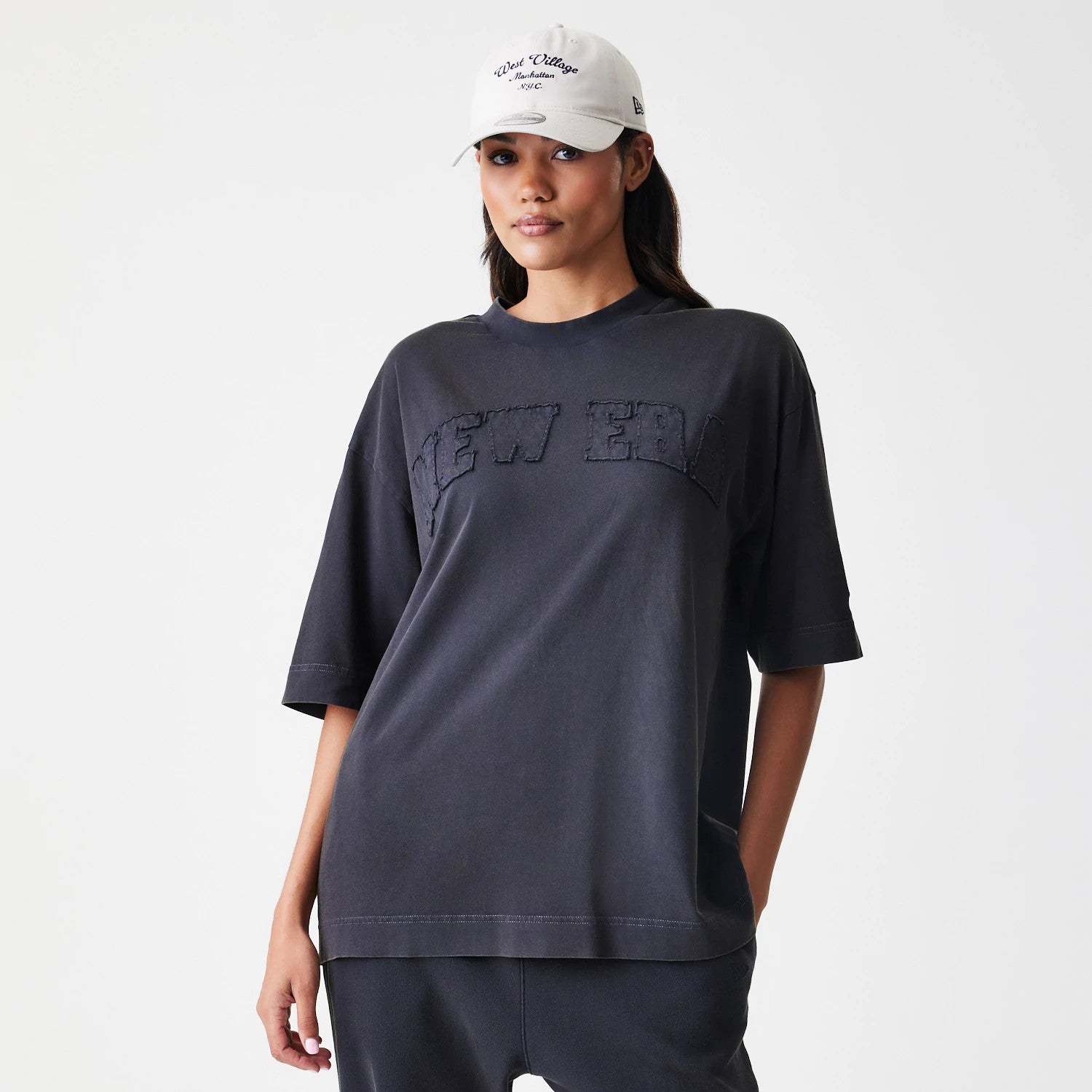 The Male model is wearing New Era Washed Black Oversized T-Shirt 4