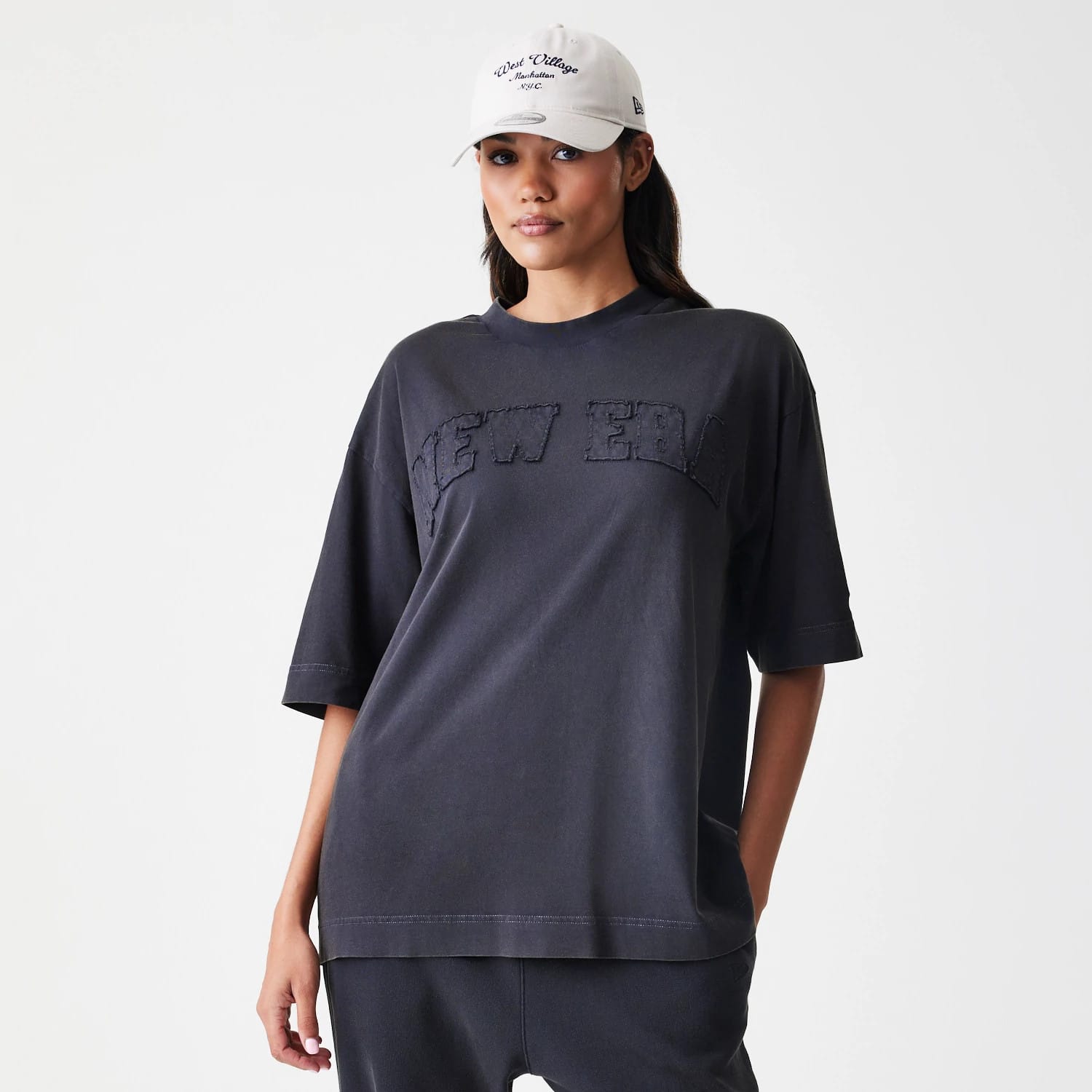 The Male model is wearing New Era Washed Black Oversized T-Shirt 4