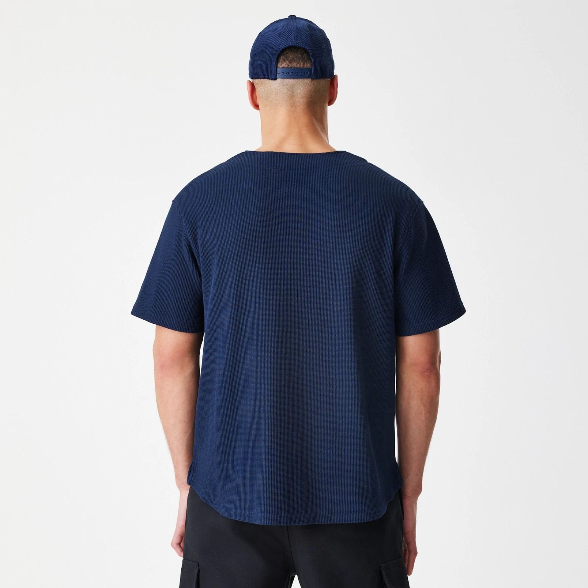 The Male model is wearing New Era Waffle Navy Jersey 2
