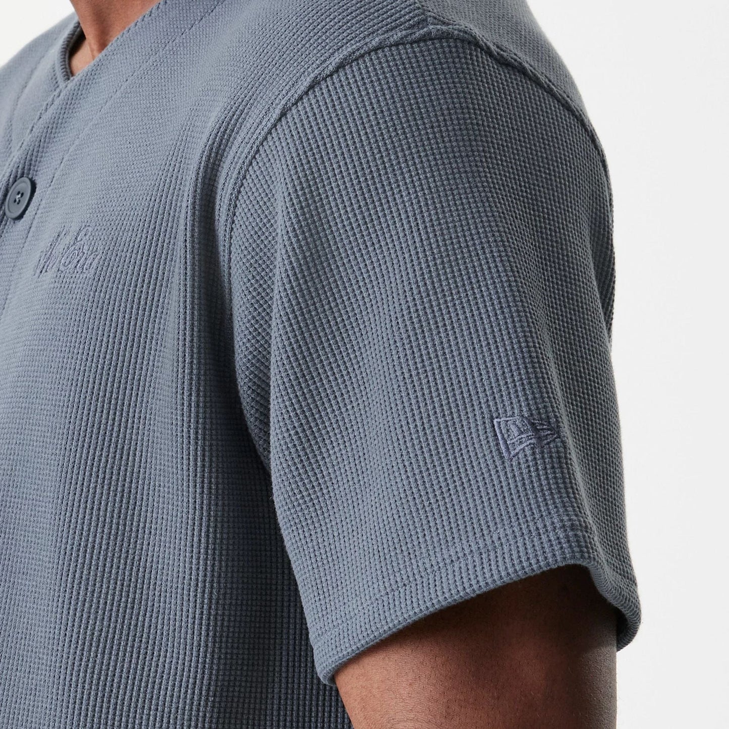 The Male model is wearing New Era Waffle Dark Grey Jersey 8