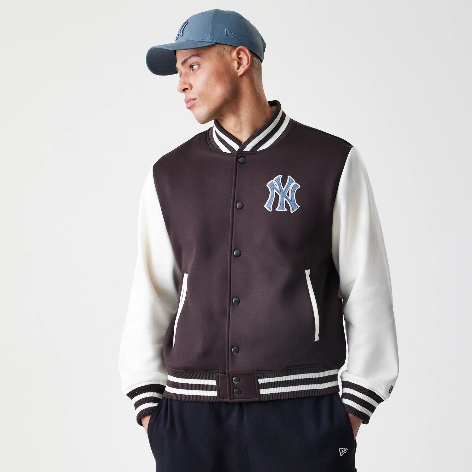 The Male model is wearing New York Yankees MLB Dark Brown Varsity Jacket 3