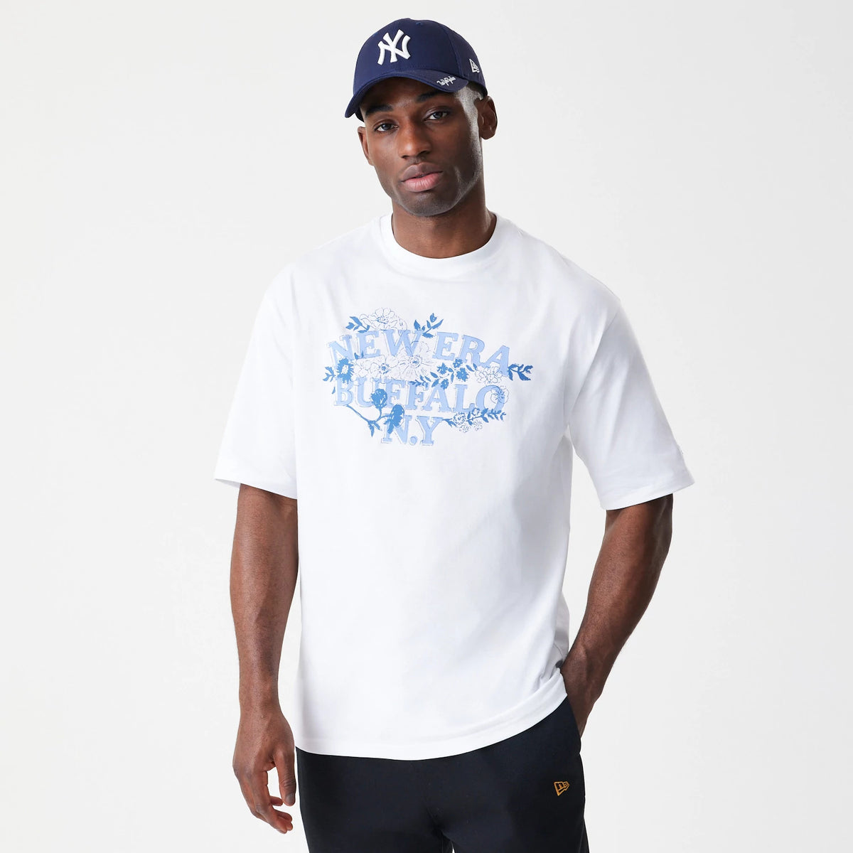 The Male model is wearing New Era Floral White Oversized T-Shirt 3