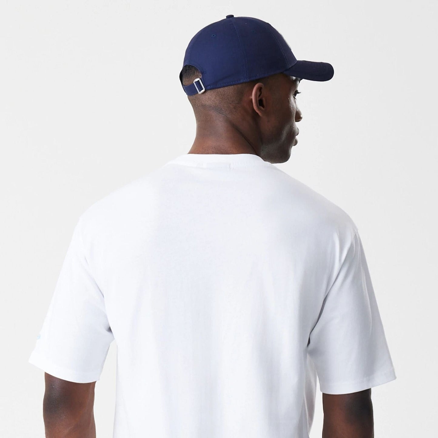 The Male model is wearing New Era Floral White Oversized T-Shirt 8