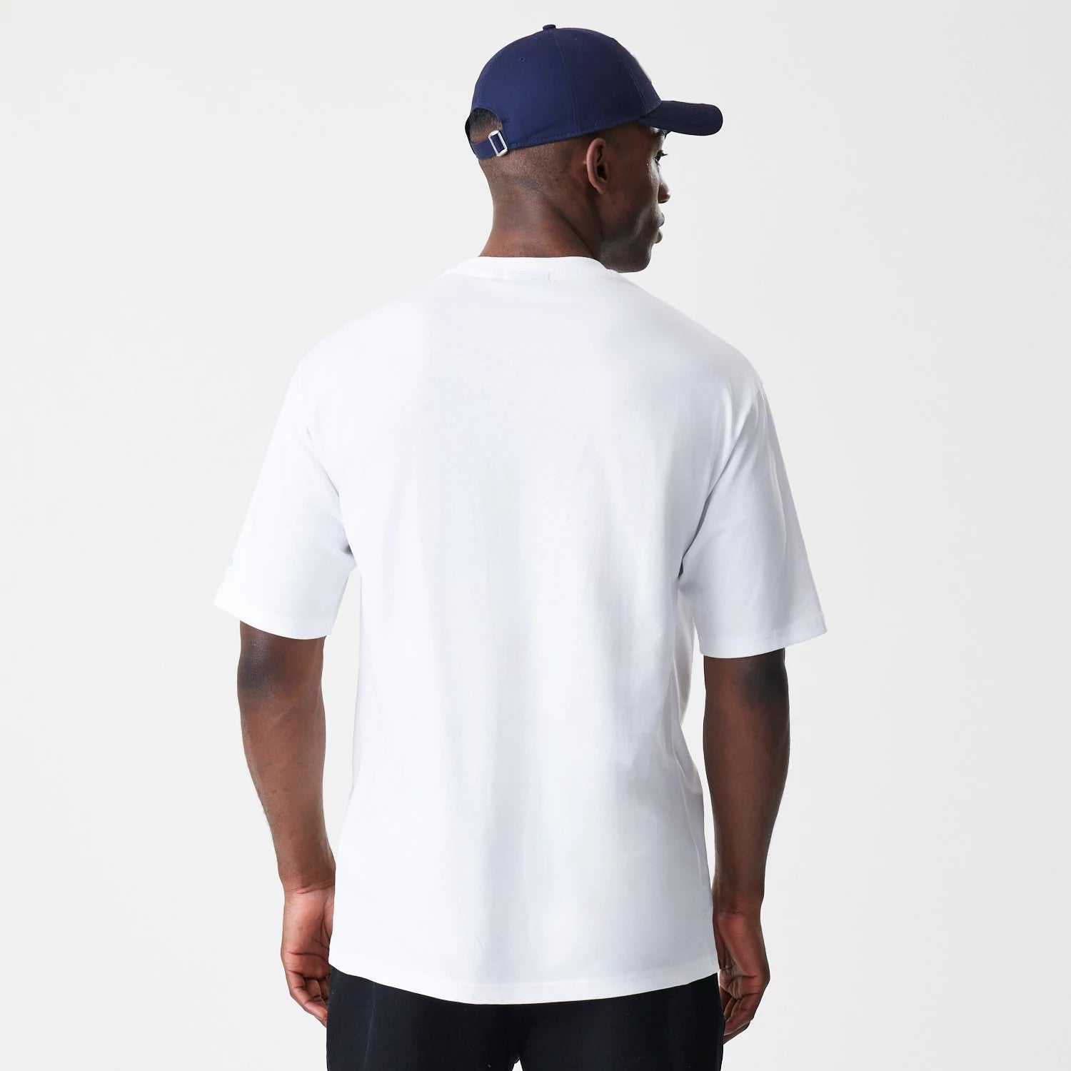 The Male model is wearing New Era Floral White Oversized T-Shirt 2