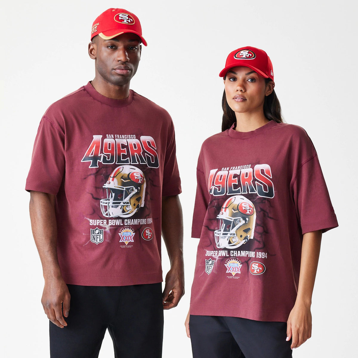 New Era San Francisco 49ers NFL Washed Boxy Dark Red Oversized T-Shirt, front view showing 49ers lettering with a football helmet graphic and Super Bowl Champions 1994 detail, worn by a model in casual style.