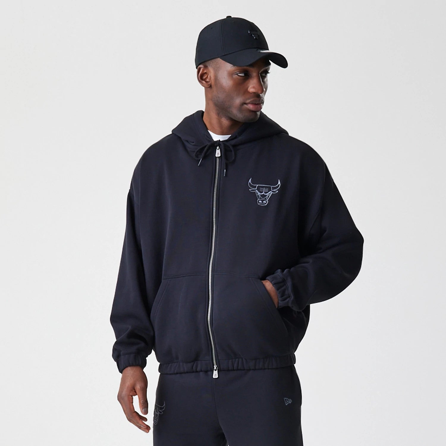 The Male model is wearing Chicago Bulls NBA Linear Black Oversized Full Zip Hoodie 3