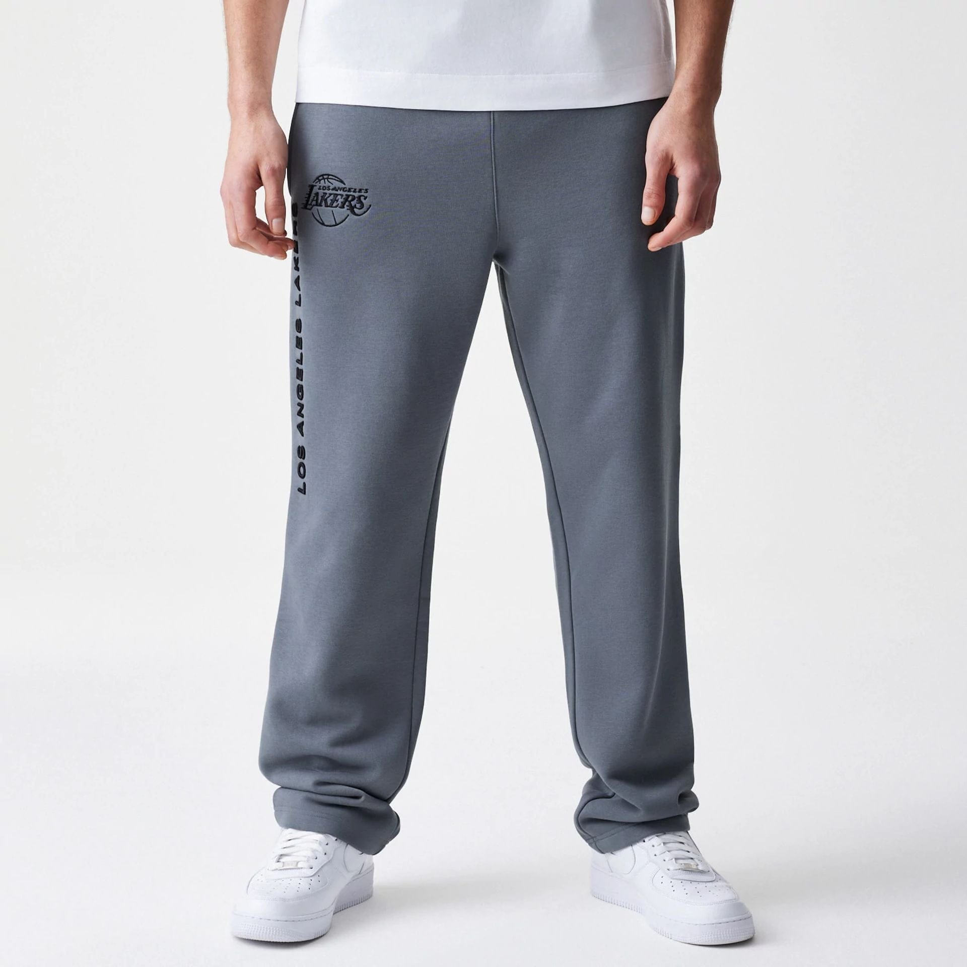The Male model is wearing LA Lakers NBA Linear Dark Grey Straight Leg Joggers 1