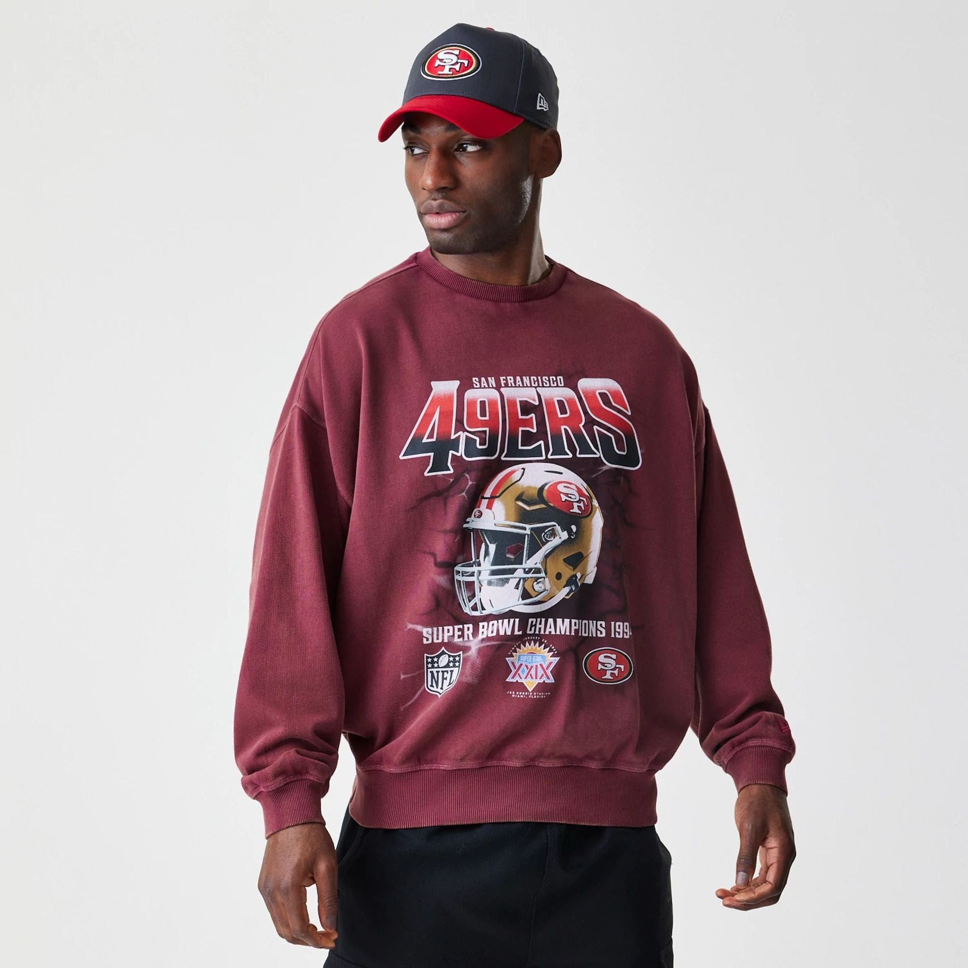 The Male model is wearing San Francisco 49ers NFL Washed Boxy Dark Red Oversized Crew Neck Sweater 1